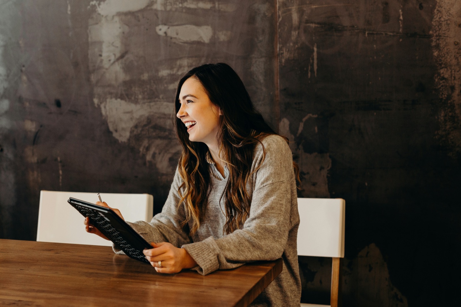 A VIVLA partner advisor reviewing an investment on a tablet